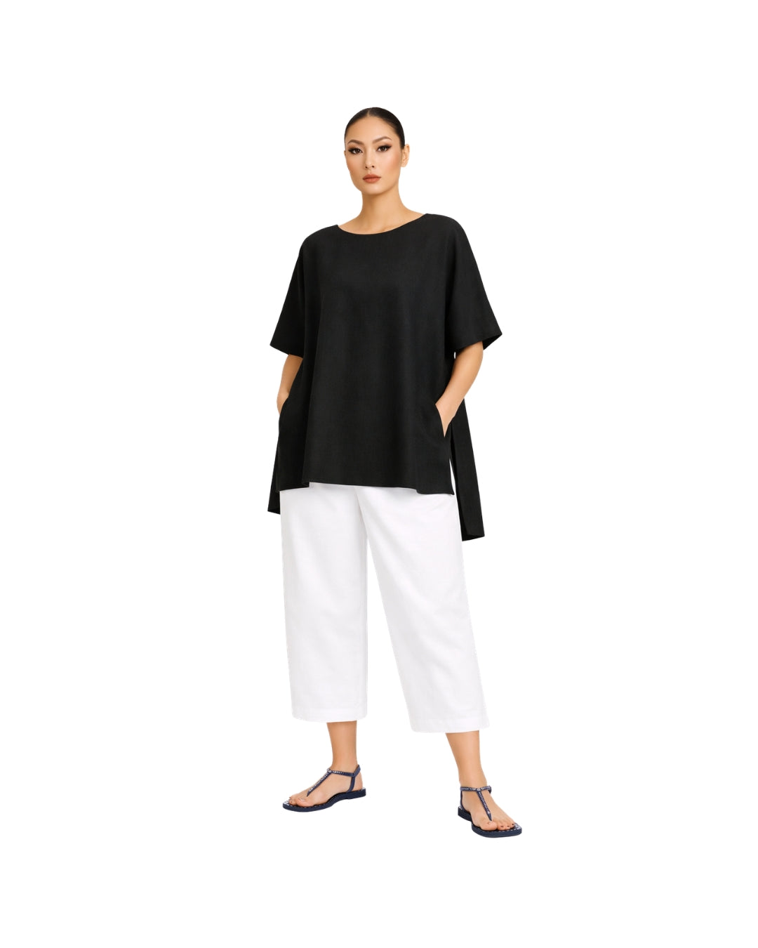 Jen Kahn Tokyo linen tunic in black worn on model with short sleeves, hidden seam pockets and longer back hem