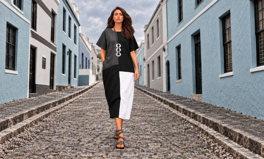 Model wearing the Jen Kahn Blocked Linen Dress on a cobbled Cape Town street.
