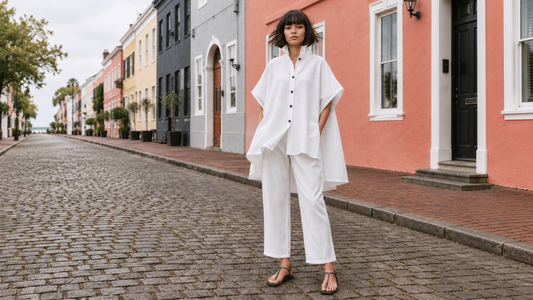 Full-length front view of a model wearing the white Linen Tokyo Shirt with white cropped linen pants.