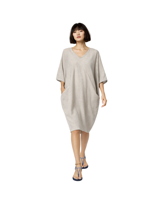 Jen Kahn yachting dress in natural linen worn on model with batwing shape and V neckline