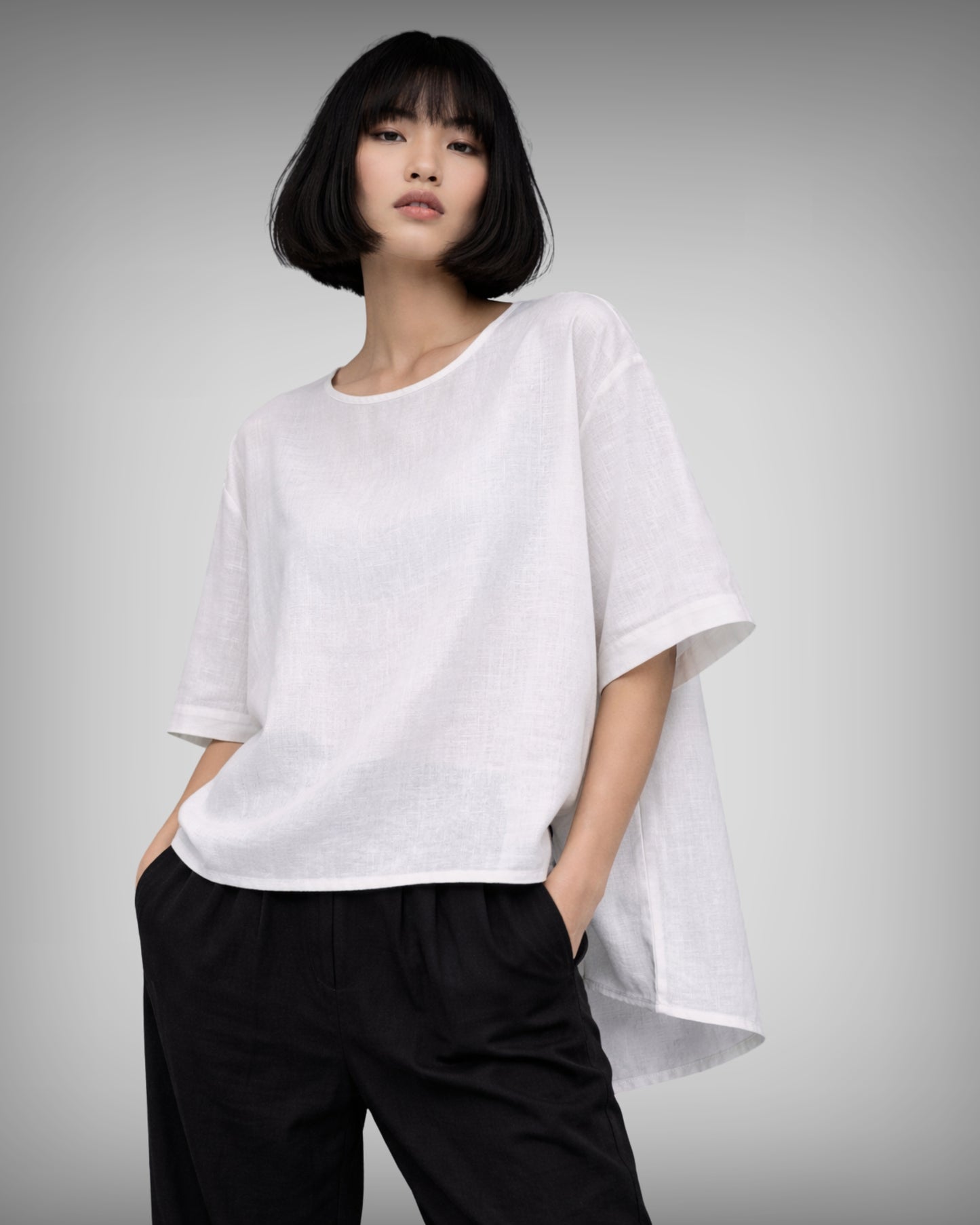 Model wearing the jen kahn Tokyo Top in pure breathable linen.