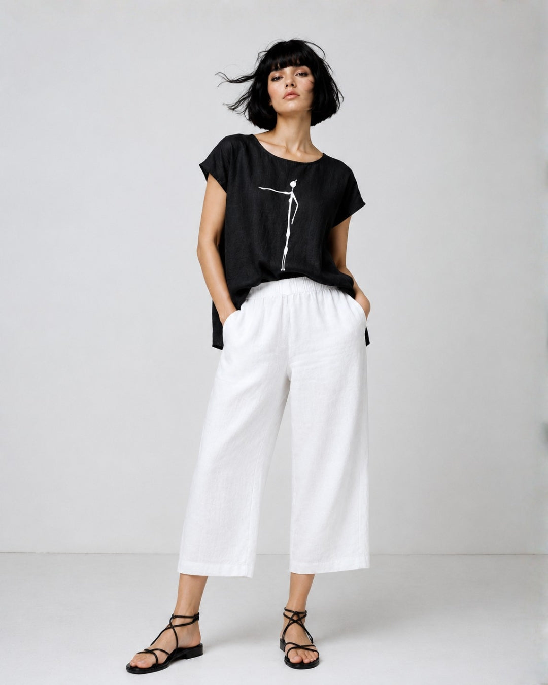 jen kahn Cave Print Linen Top in Black pure linen with a contrasting white cave figure print, worn on model.