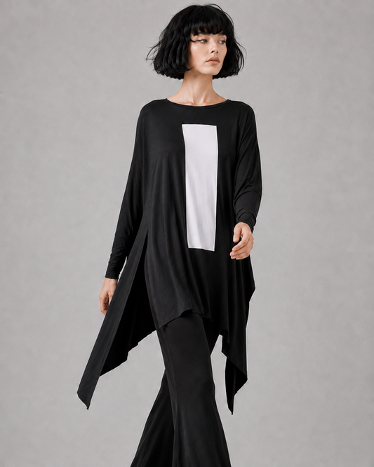 jen kahn Column Jersey Knit Top in Black with white column print, featuring an asymmetric draped hem and side slits, styled with black flared jersey pants.