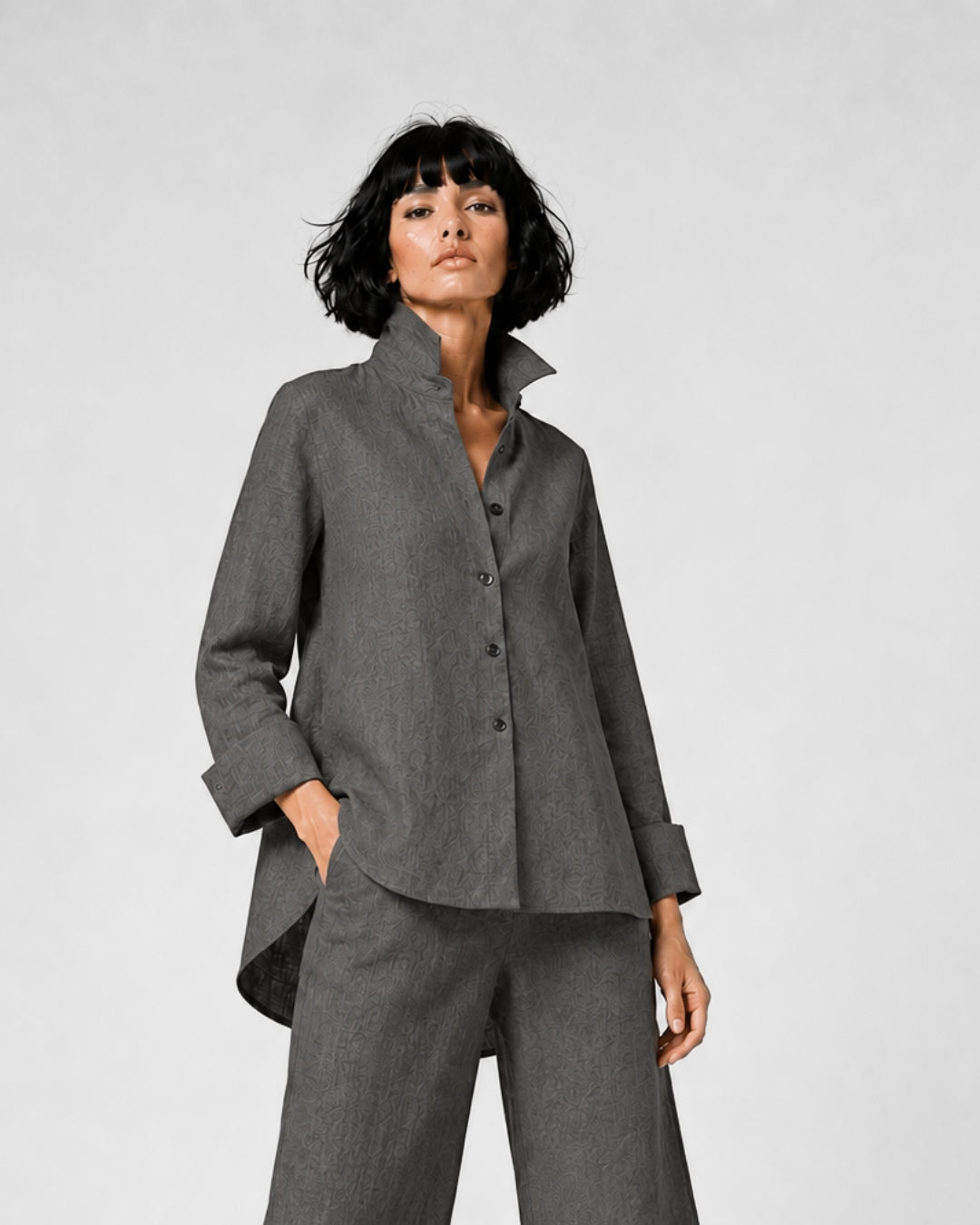 Jen Kahn Flared Linen Shirt in Anthracite pure linen with a fitted bust, elegant flared shape, button-through front and longer rounded back hem.