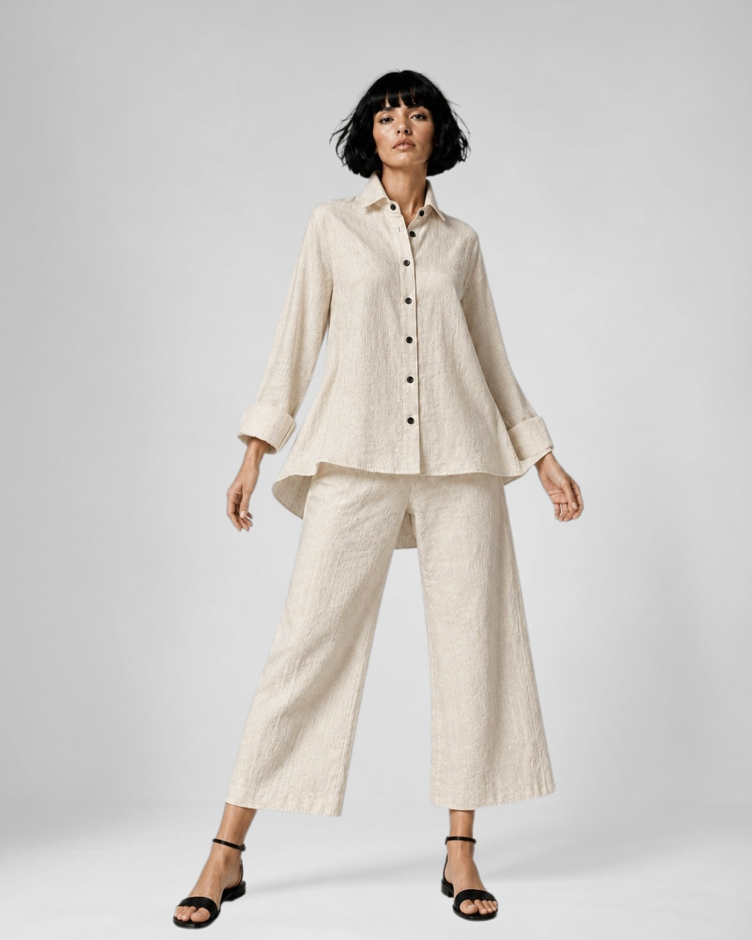 Jen Kahn Flared Linen Shirt in Natural pure linen with a stand collar, button-through front, softly flared shape and asymmetric hem.