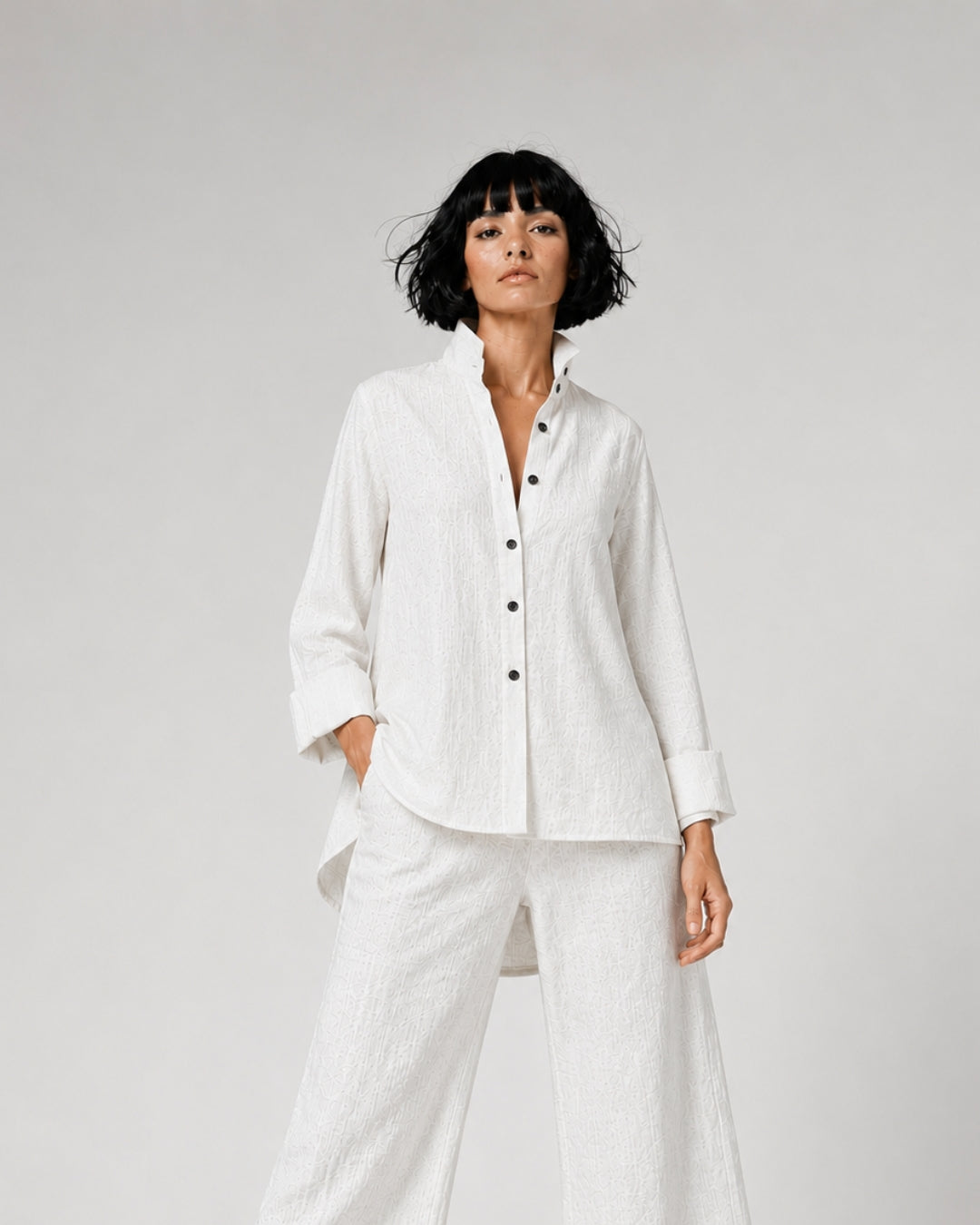 Jen Kahn Flared Linen Shirt in White pure linen with a fitted bust, softly flared silhouette, fold-back cuffs and longer rounded back hem.