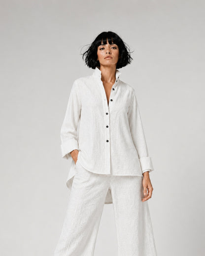Jen Kahn Flared Linen Shirt in White pure linen with a fitted bust, softly flared silhouette, fold-back cuffs and longer rounded back hem.