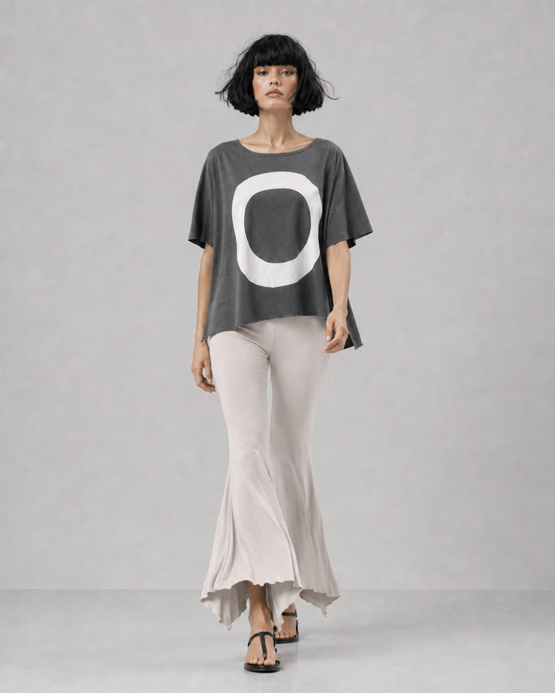 jen kahn Jersey Knit Pointed Pants in Stone with a fluid flared leg and distinctive pointed hem, shown on model walking.