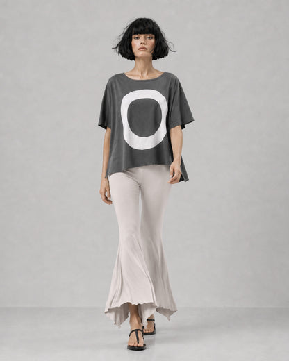 jen kahn Jersey Knit Pointed Pants in Stone with a fluid flared leg and distinctive pointed hem, shown on model walking.