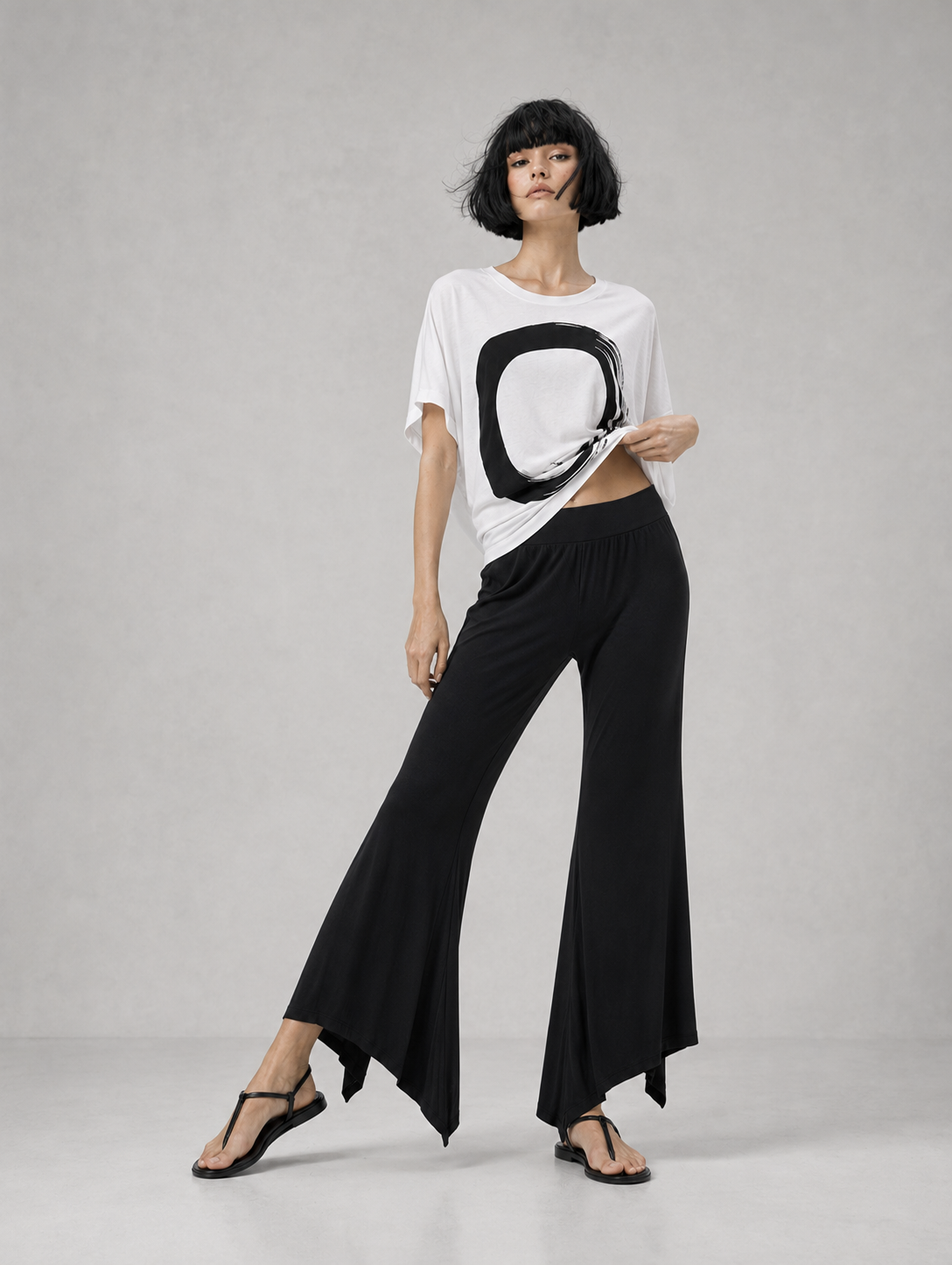 jen kahn Jersey Knit Pointed Pants in Black with a fluid flared leg and distinctive pointed hem, shown on model from the front.