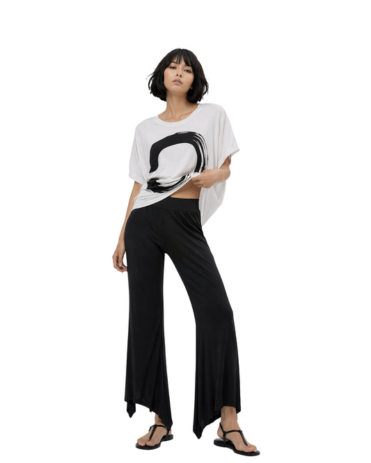Jen Kahn black jersey knit pointed pants with flared hem and elastic worn on modelwaistband