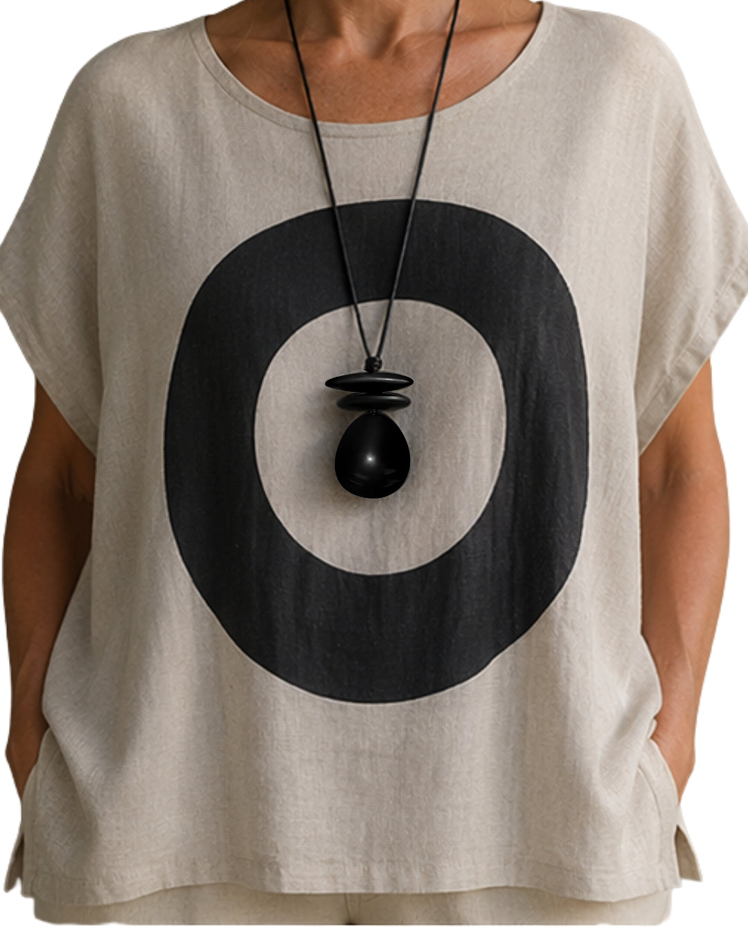 Jen Kahn leather dome pendant worn on model over linen top