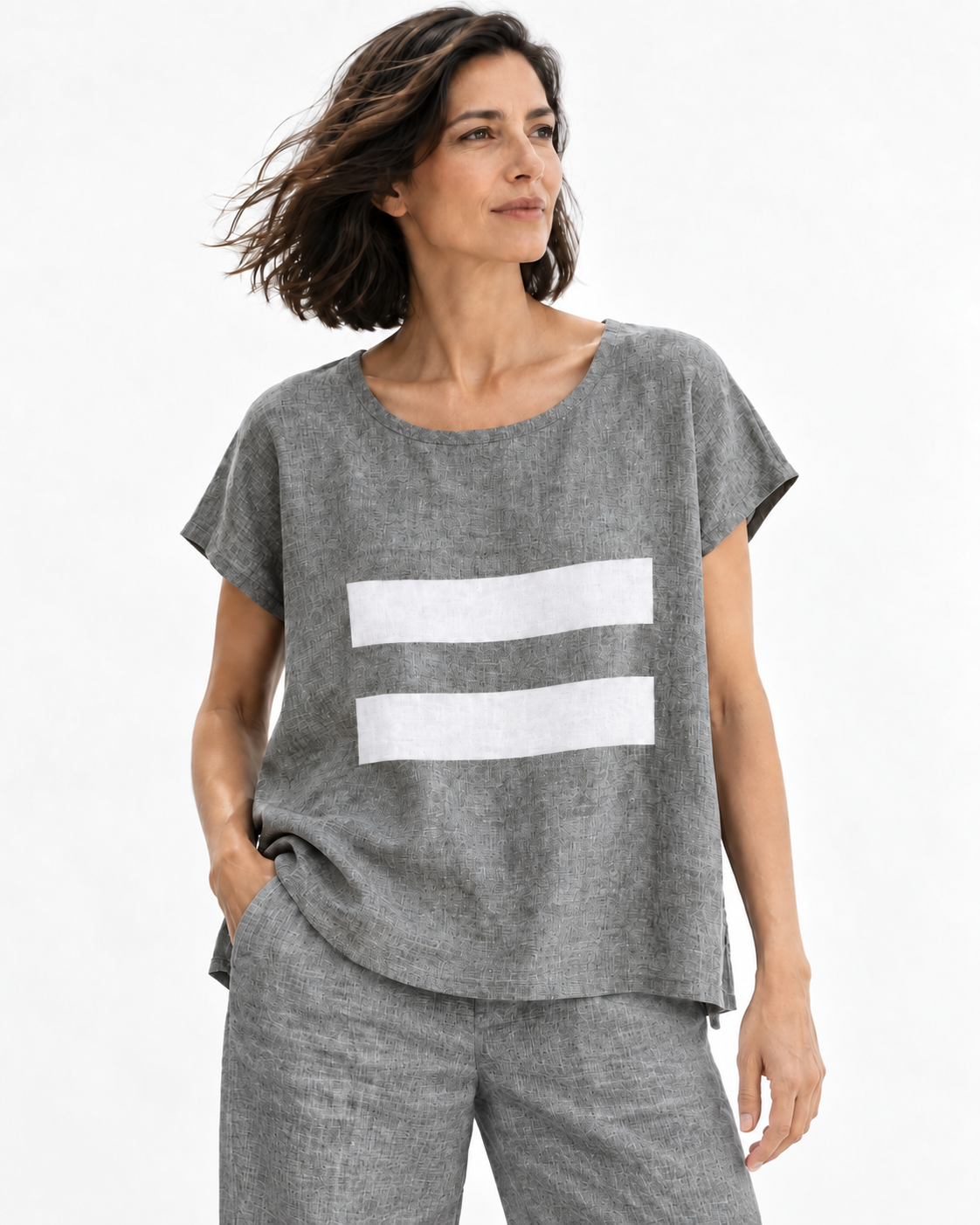 Model wearing the Jen Kahn Linear Linen Top with matching melange-grey linen trousers.
