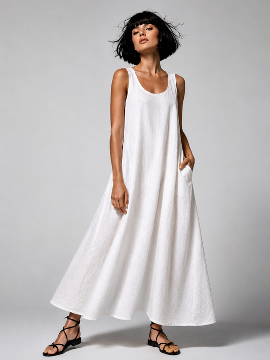 jen kahn Linen Cruise Dress in White pure linen with a scoop neckline, bias-cut shape, side-seam pockets and long flowing line.