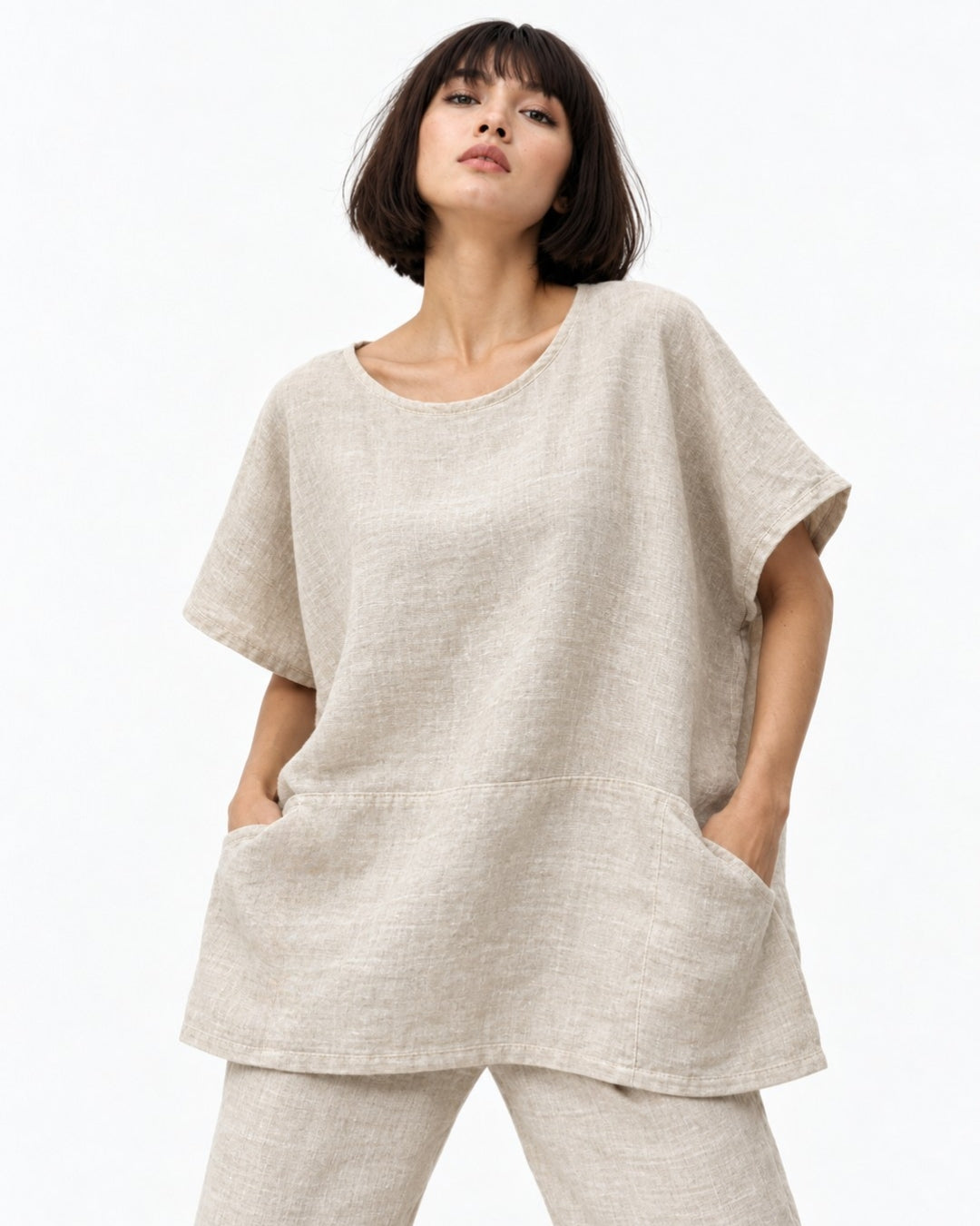 jen kahn Linen Pocket Top in Natural, showing the round neckline, short sleeves and seam-set front pockets.