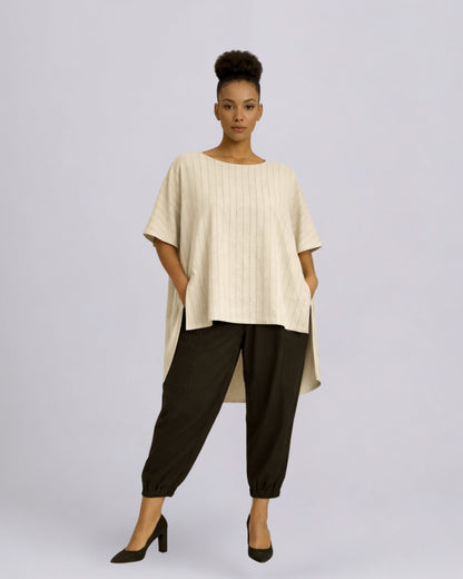 Jen Kahn Long Tokyo linen tunic worn on model in natural pinstripe with short sleeves, hidden seam pockets and longer back hem