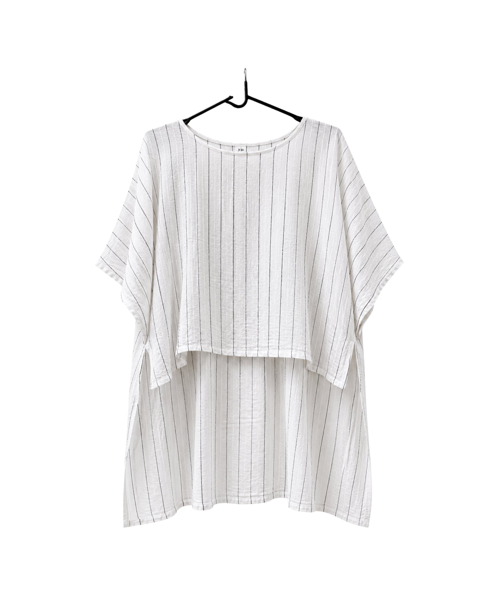 Jen Kahn long Tokyo linen tunic on a hanger with  short sleeves, hidden seam pockets and longer back hem in white with black pinstripe