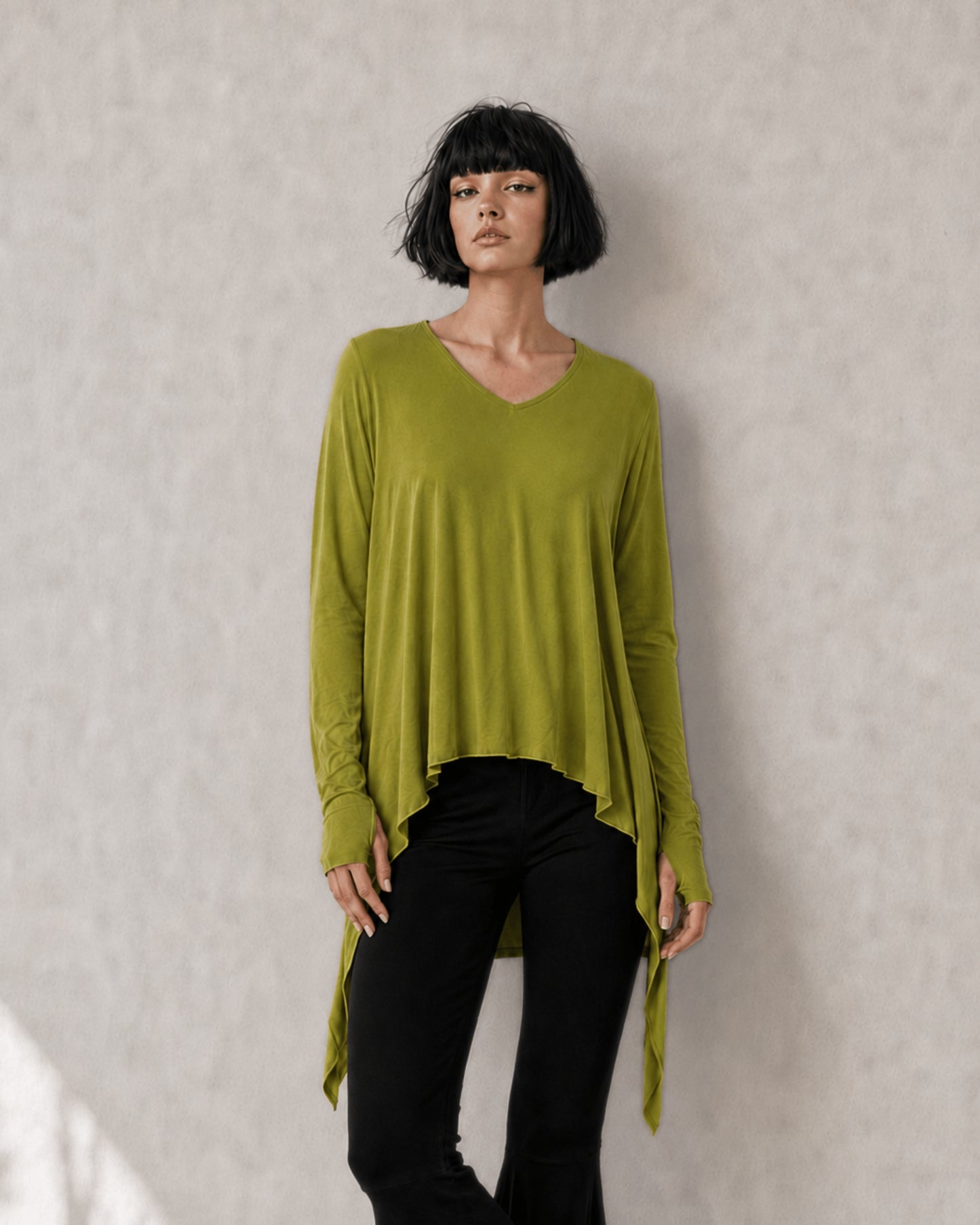 jen kahn Pointed Jersey Top in Chartreuse crafted from luxurious imported jersey knit with a V-neck, built-in mittens and an asymmetric pointed hem.