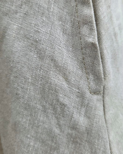 Close-up of the Jen Kahn Riviera Dress showing the textured pure linen weave and stitched seam detail.