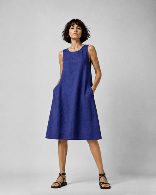 Jen Kahn Short Linen Dress in Indigo pure linen with a sleeveless design, rounded neckline, in-seam pockets and relaxed knee-length shape.