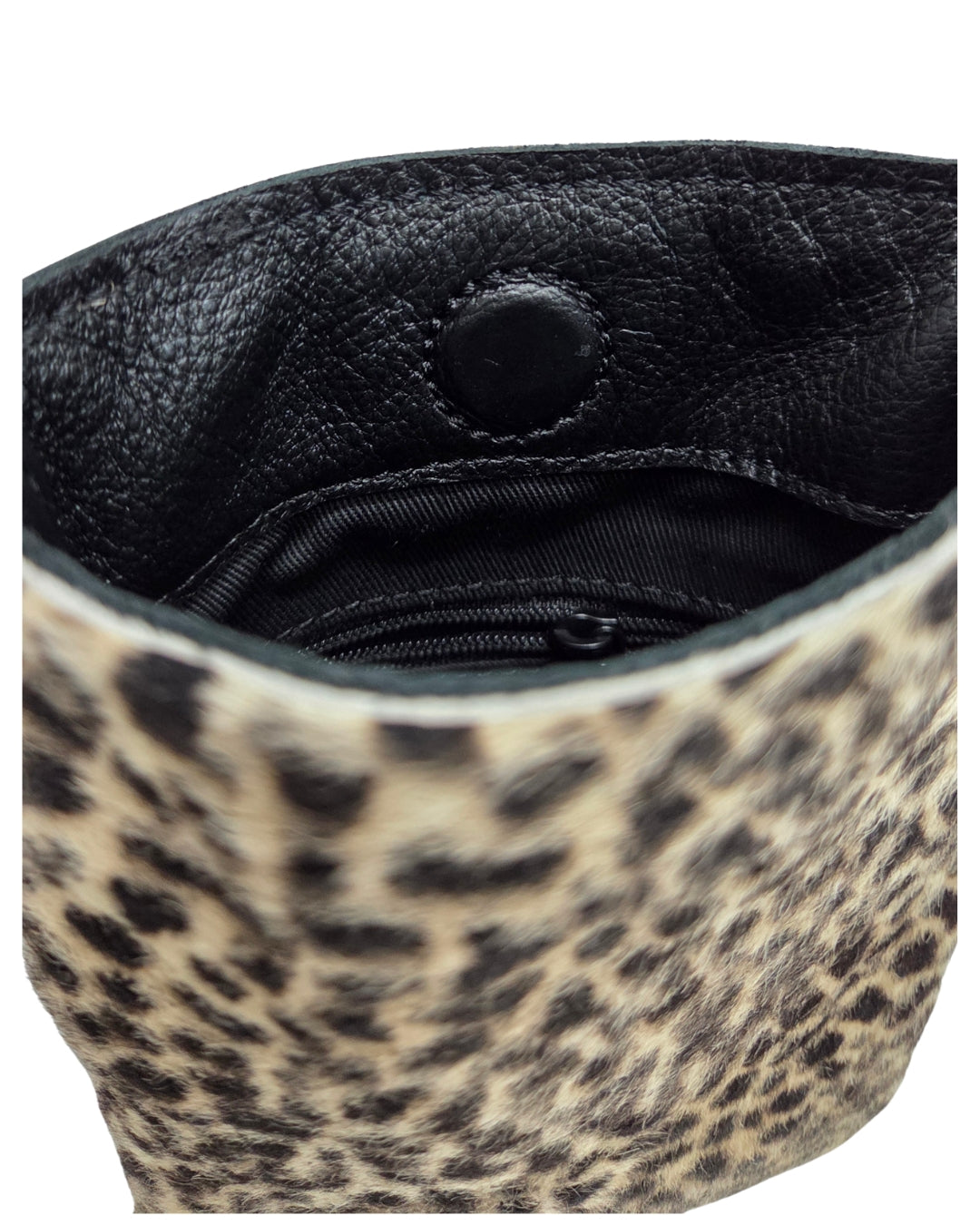 Close-up of the Jen Kahn small leather shoulder bag interior in leopard print calfskin, showing the lined interior, concealed magnetic closure, and internal zip pocket.