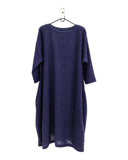 Jen Kahn Tokyo linen dress in Eclipse blue on a hanger, showing its relaxed cocoon shape.