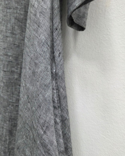 Close-up of the Jen Kahn Tokyo dress in grey mélange linen, showing the textured weave and side-seam pocket.