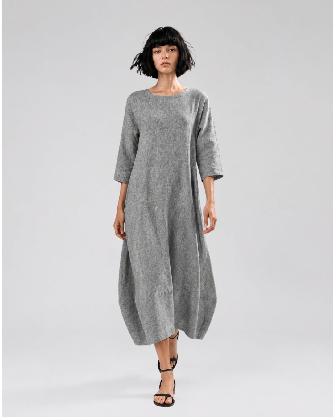 jen kahn Tokyo Linen Dress in Melange Grey pure linen with three-quarter sleeves and a softly shaped bell silhouette, shown on model.