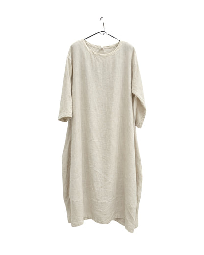 Jen Kahn Tokyo linen dress in natural on a hanger, showing its linen texture and relaxed drape.