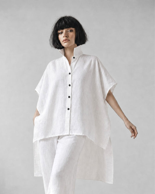 jen kahn Tokyo Linen Shirt in White made from pure linen with a classic shirt collar, relaxed box-cut silhouette, high-low hem and deep side slits.