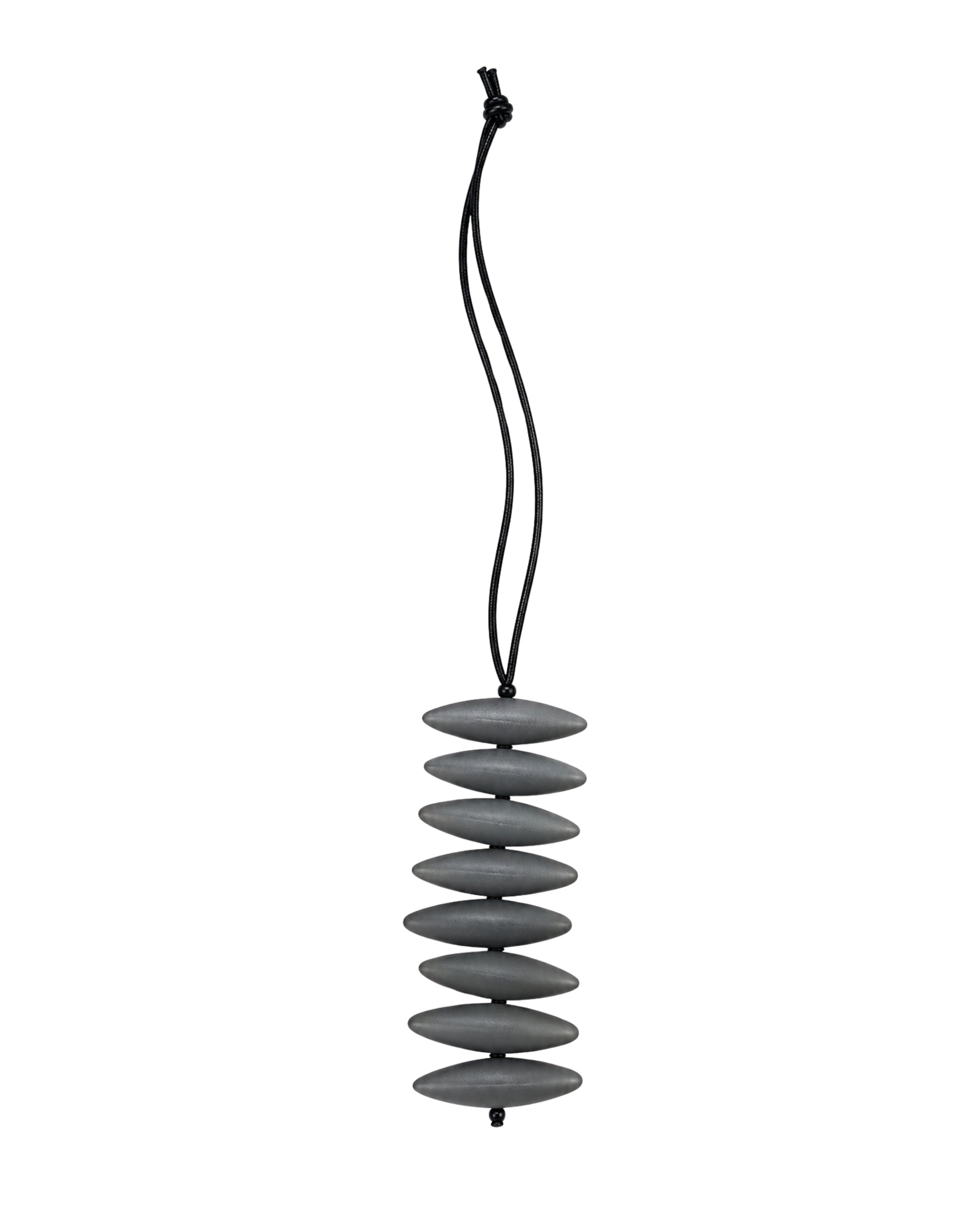 The jen kahn Assegai Pendant in bronze imported European resin beads suspended on a soft leather cord.