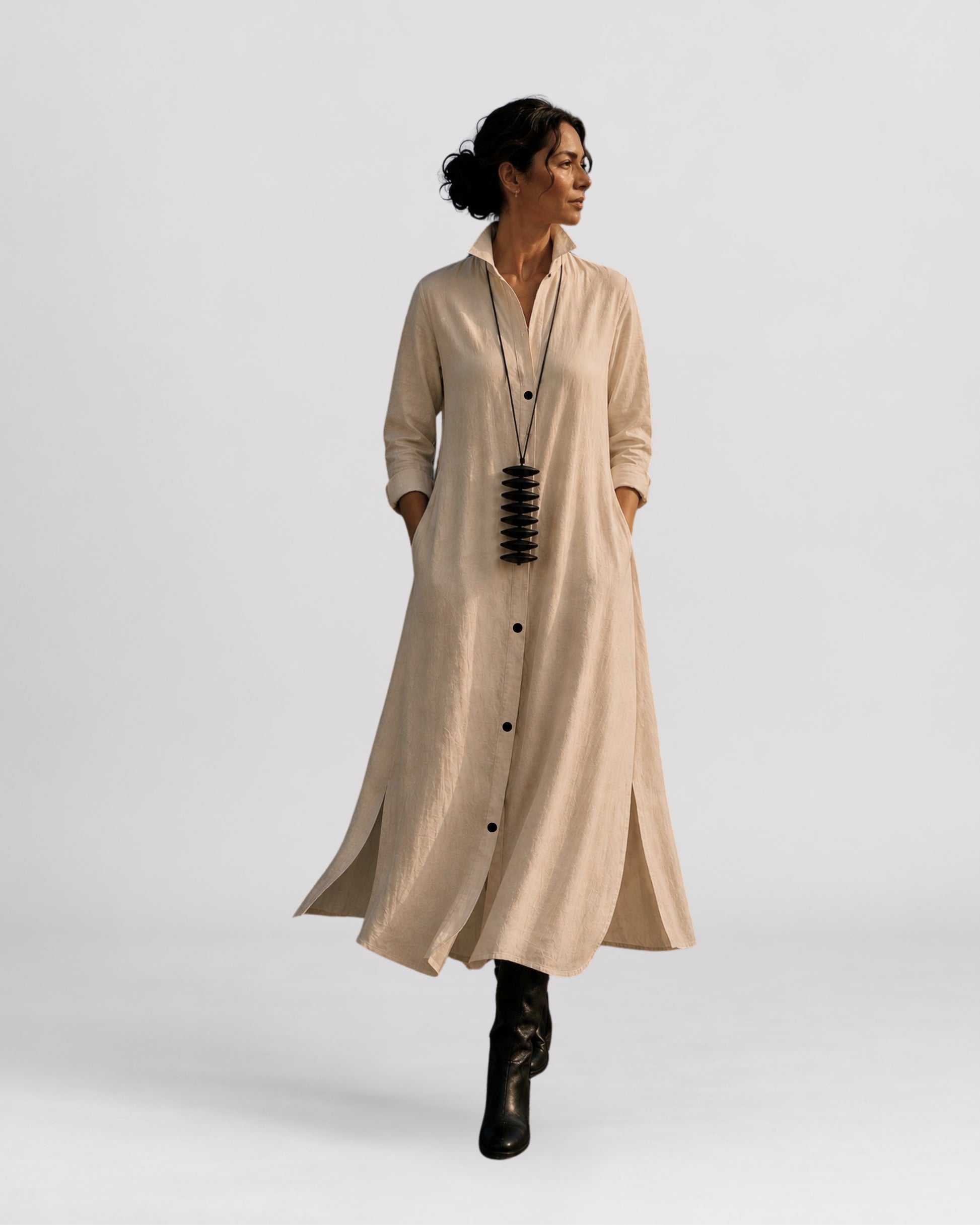 Model wearing the jen kahn Long Linen Shirt Dress in white pure linen with a structured collar and button-down front along the Cape Town promenade.