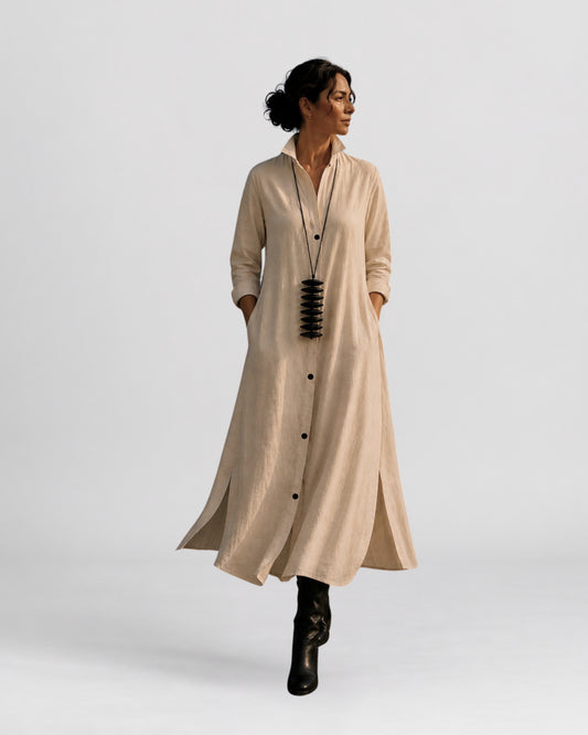 Model wearing the jen kahn Long Linen Shirt Dress in white pure linen with a structured collar and button-down front along the Cape Town promenade.