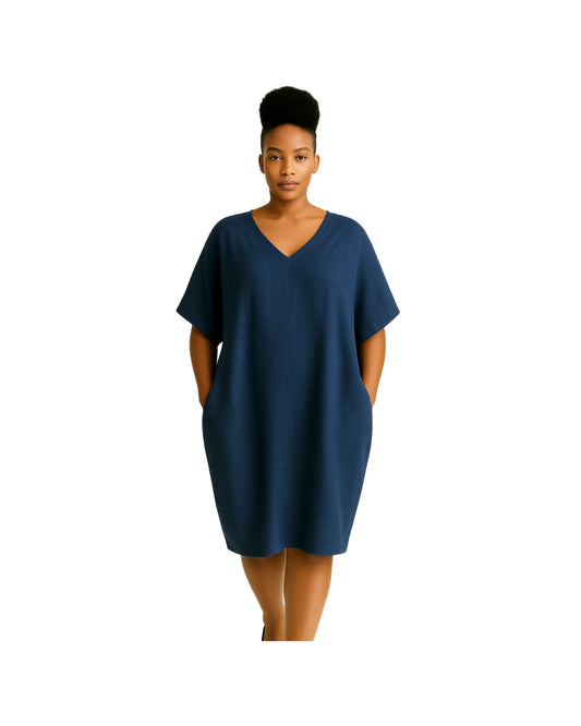 Model wearing Linen Yachting Dress in Indi— women’s pure linen batwing dress with in-seam pockets and tapered hem